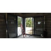 Baie à galandage épaisseur dormant 160 mm maison en cours de construction