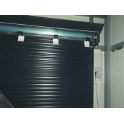 Verrouillage automatique porte de garage enroulable SOMFY